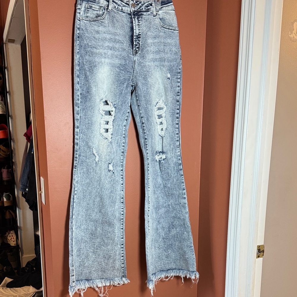 Distressed stretchy flare jeans